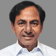 a close up of a man 's face against a grey background