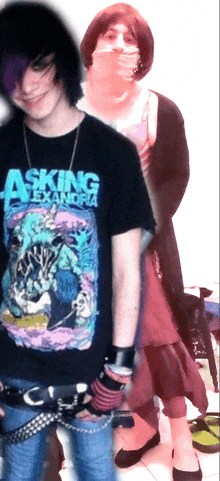 a person wearing an asking alexandria shirt stands next to another person