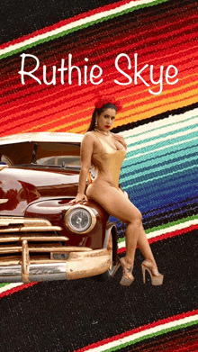 ruthie skye is sitting on a car with a mexican blanket in the background