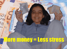 a girl is sitting in front of a pile of money with the words more money = less stress below her