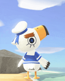 a stuffed animal with a blue and white outfit and a hat