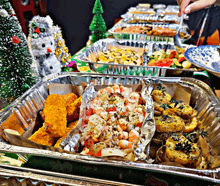 a tray of food with a snowman behind it