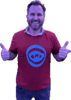 a man wearing a red t-shirt with a blue circle on it gives two thumbs up