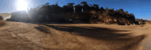 a dirt road with a sign that says ' no parking ' on it