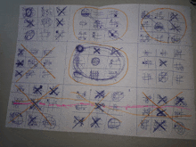 a child 's drawing of a tic tac toe game with the number 10 crossed out in red