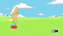 a cartoon horse is standing on a blue ball in a field .