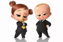 a little girl with a pacifier in her mouth and a little boy in a suit and tie