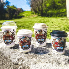 four different sizes of mrs. rose coffee cups