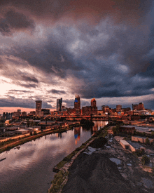 a view of a city with a river in the foreground