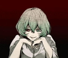 a girl with green hair and red eyes is smiling and making a heart with her hands .