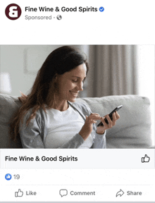 a facebook ad for fine wine and good spirits shows a woman smiling while looking at her phone