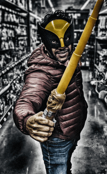 a man wearing a mask and holding a yellow pole