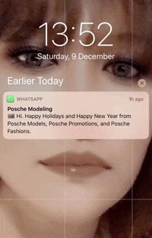 a woman 's face is displayed on a phone screen with a message from whatsapp