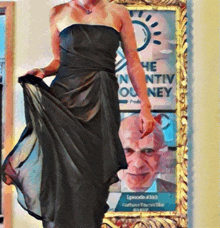 a woman in a black dress is standing in front of a framed picture that says the ntiv ouney