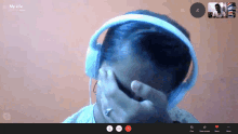 a person wearing headphones is on a video call with the words my life on the bottom