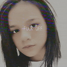 a close up of a woman 's face with the words fuck off written on it