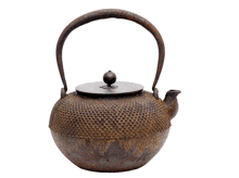 a rusty tea kettle with a wooden handle and lid