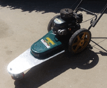 a lawn mower with the word aeromax on the front