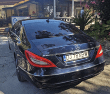 a black mercedes with a license plate dj78xbw