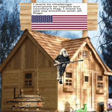 a man sitting on a broom in front of a house with an american flag above him