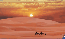 a group of people riding camels in the desert with the sun setting in the background