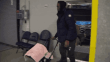 a man is pushing a stroller with a baby in it