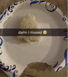 a paper plate with a bite taken out of it and the words " damn i missed "