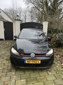 a black volkswagen with a license plate nf-792-l