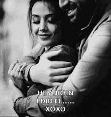 a man hugging a woman with the words hey john i did it xoxo