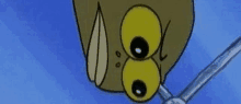 a close up of a cartoon character 's face with big yellow eyes and a blue background .