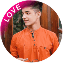 a picture of a young man with a love sticker around his neck