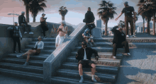 a group of people are posing for a picture on a set of steps