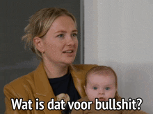 a woman holding a baby with the words wat is dat voor bullshit on the bottom