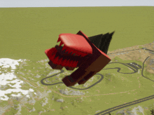 a red object with sharp teeth is floating in the air near a road