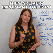 a woman stands in front of a white board with the words they are very important to learn written on it