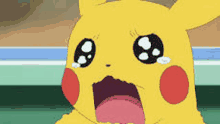 pikachu is crying with his mouth open and a tear coming out of his eye .