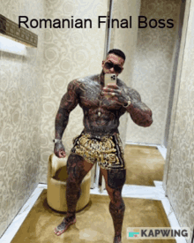 a tattooed man taking a selfie in a room with the caption romanian final boss