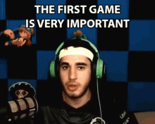 a man wearing headphones and a headband with the words the first game is very important