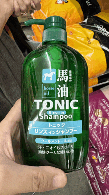 a bottle of tonic shampoo with horse oil in it