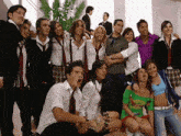 a group of young people posing for a picture with one girl wearing a green shirt that says ' mexico '