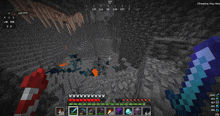 a screenshot of a minecraft game shows a few hearts and a few items