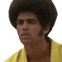 a man with an afro and a yellow shirt