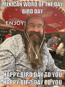 a man with a beard is wearing a sombrero and says mexican word of the day bird day enjoy