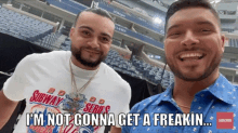 two men are posing for a picture and one of them is wearing a shirt that says subway series