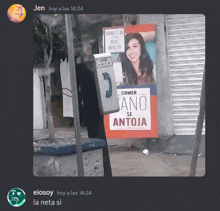 a phone booth with a sign that says " comer ano se antoja "