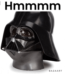 a picture of a darth vader helmet with the words " hmmmm " above it