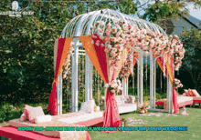 a white gazebo with pink and orange flowers and the words " book top notch koh samui wedding venue for your wedding " on the bottom