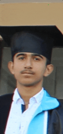 a young man wearing a graduation cap and gown