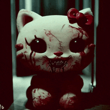 a bloody hello kitty doll with a red bow on her head