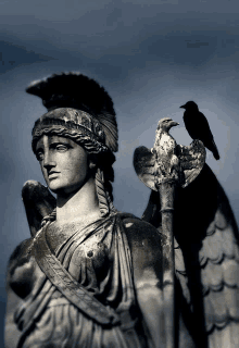 a statue of a woman with a bird perched on her shoulder has the word ' apollo ' written on it